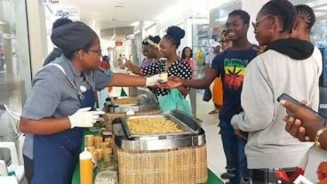 Nevis Tourism Members of team Barbados serving samples of Nevis cuisine