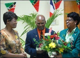 Pastor Cecil Maynard-Hodge Receives Bouquet