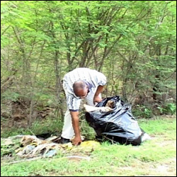 Nevis Premier Picks Up Trash