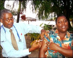 Dr. Liburd Administers Vaccine Shot To GM Faith Bertie