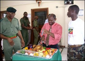 PM Douglas Carves Turkey At Luncheon