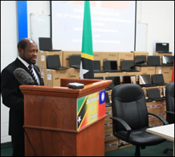 PM Douglas Surrounded by 2,400 Laptops
